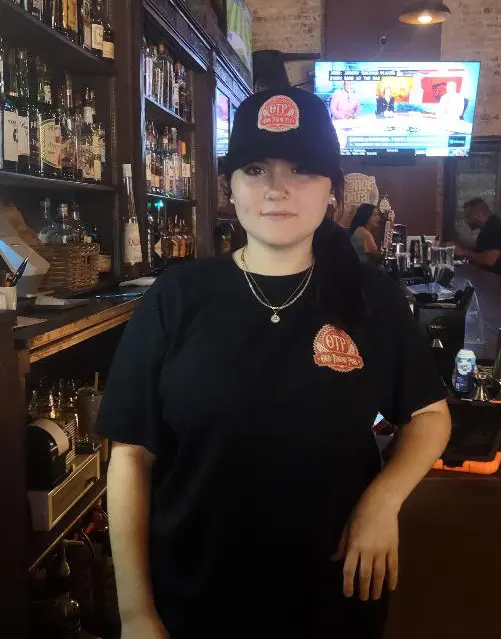A black OTP cap with the Old Towne Pub seal embroidered on the front
